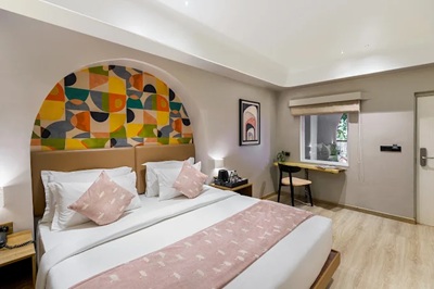 Suite with Pool View at The Red Pier by Downtown Udaipur overlooking the swimming pool with modern luxury.