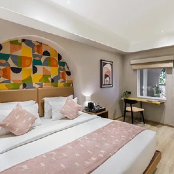 Suite with Pool View at The Red Pier by Downtown Udaipur overlooking the swimming pool with modern luxury.